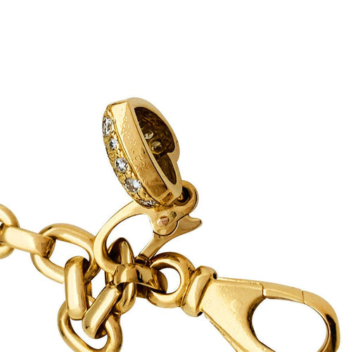 Bracelet Bracelet Cartier en or jaune, 6 breloques, diamants, émeraudes et rubis. 58 Facettes 30849/55