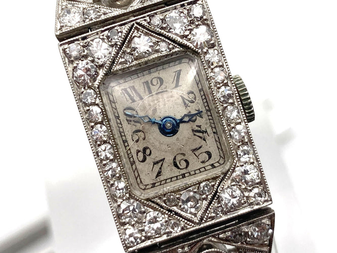 Montre Montre Art Déco platine & or blanc, diamants 2.44 cts 58 Facettes 07/07 - 16