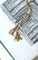 Collier Collier trois ors négligé pompons 58 Facettes