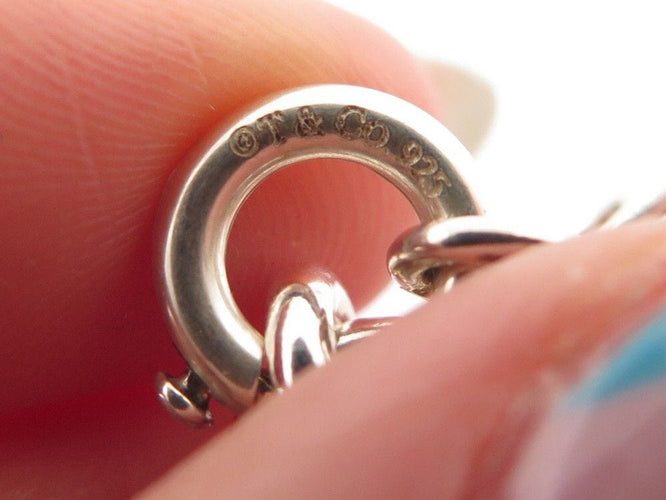 Bracelet bracelet TIFFANY & CO chaine a breloques charms 19 argent 58 Facettes 254453