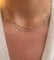 Collier Collier or jaune intercalé de 9 diamants sur maille forçat en sertis clos. 58 Facettes 0