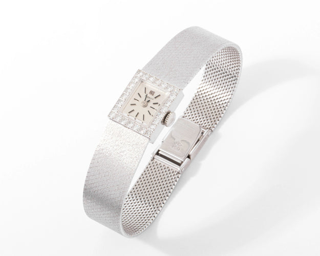 Montre Montre Tissot or gris et diamant 58 Facettes 0