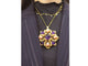 Broche broche pendentif VAN CLEEF & ARPELS delphes 1975 or cabochons corail & amethyste 58 Facettes 257359