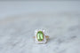 Bague Bague Belle Epoque Péridot entourage diamants 58 Facettes
