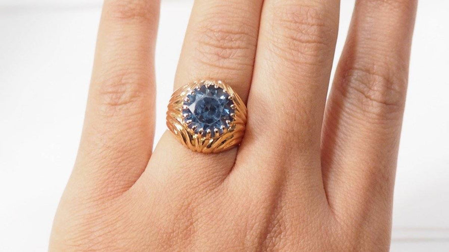 Bague Bague godronnée or jaune et topaze bleue 58 Facettes 30912