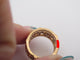 Bague 54 CARTIER - Bague "Rivière" or jaune, diamants, saphirs, rubis & émeraudes 58 Facettes 245801