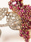 Broche Broche Fleur deux ors, pavage rubis et diamants 58 Facettes