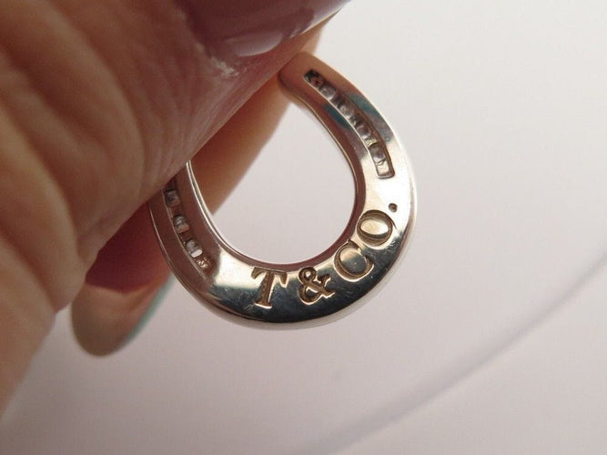 Bracelet bracelet TIFFANY & CO chaine a breloques charms 19 argent 58 Facettes 254453