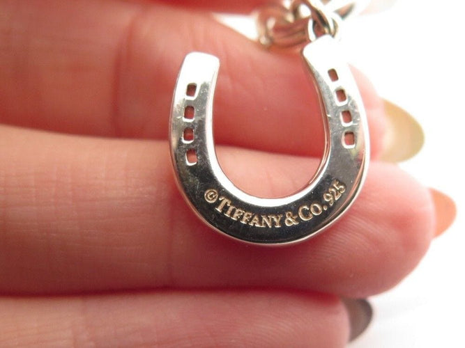 Bracelet bracelet TIFFANY & CO chaine a breloques charms 19 argent 58 Facettes 254453