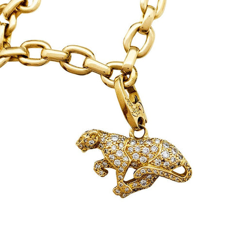 Bracelet Bracelet Cartier en or jaune, 6 breloques, diamants, émeraudes et rubis. 58 Facettes 30849/55