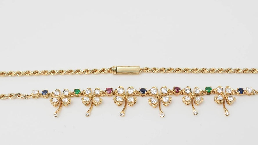 Collier Collier trèfles en or jaune et diamants 58 Facettes 32546