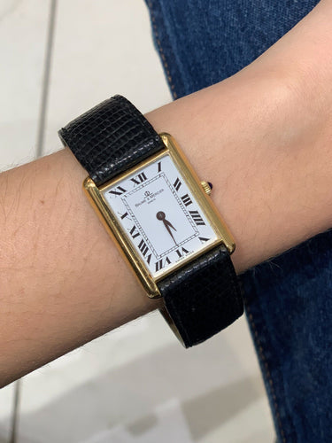 Montre Montre Baume & Mercier, Modèle Tank, Remontoir Saphir, Or jaune 58 Facettes