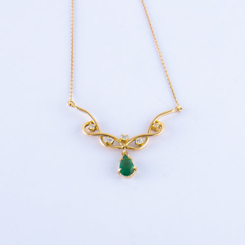 Collier Collier Volutes en or jaune, émeraude diamants 58 Facettes ALGU04