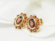 Boucles d'oreilles Boucles d'oreilles marguerite or jaune et grenats 58 Facettes 25806