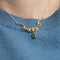 Collier Collier Volutes en or jaune, émeraude diamants 58 Facettes ALGU04