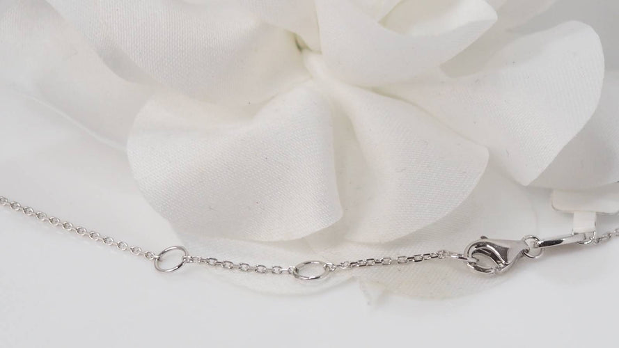 Collier Collier pendentif en or blanc, diamants et Rubis en poire 58 Facettes 31209