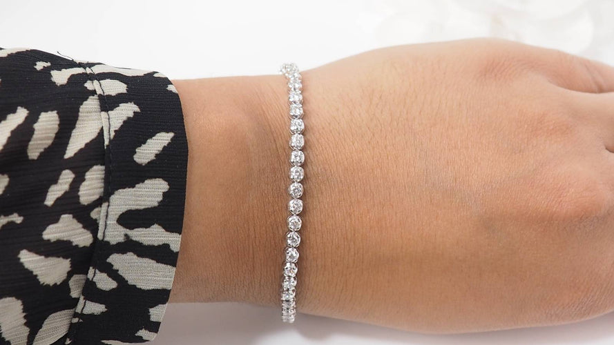 Bracelet Bracelet rivière en or blanc et diamants sertis clos 58 Facettes 31743