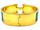 Bracelet HERMÈS. Bracelet métal doré et émail 58 Facettes
