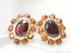 Boucles d'oreilles Boucles d'oreilles marguerite or jaune et grenats 58 Facettes 25806