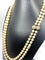 Collier Double collier de perles fermoir diamants. 58 Facettes AB170