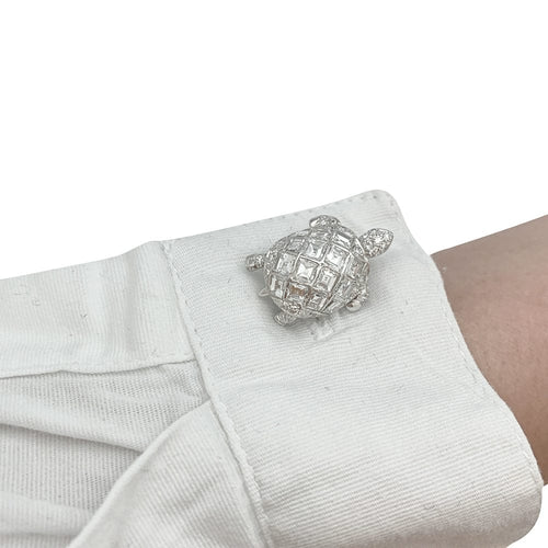 Boutons de manchette Boutons de manchette "Tortues" en platine, sertis de diamants. 58 Facettes 30067