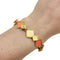 Bracelet Bracelet en or jaune, corail et diamants. 58 Facettes 28426