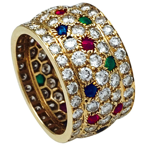 Bague 55 Bague Cartier, modèle Nigeria, en or jaune, diamants, rubis, saphirs et émeraudes. 58 Facettes 30384
