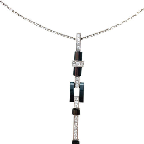 Collier Collier Cartier "Attraction" en or blanc, diamants, onyx et nacre. 58 Facettes 30008