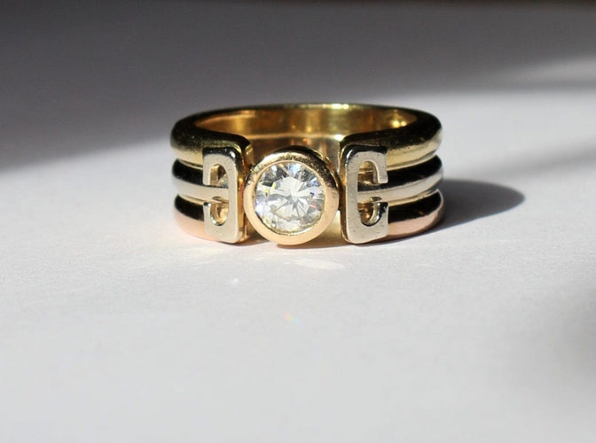 Bague Bague trois Ors sertie d'un diamant 58 Facettes 355