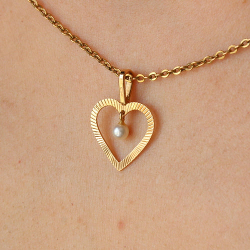Pendentif Pendentif coeur et sa perle 58 Facettes 19-455H