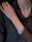 Bracelet Cartier - Bracelet Vintage Panthère en diamants, émeraudes, émail et or blanc 58 Facettes