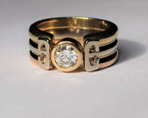 Bague Bague trois Ors sertie d'un diamant 58 Facettes 355