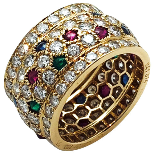 Bague 55 Bague Cartier, modèle Nigeria, en or jaune, diamants, rubis, saphirs et émeraudes. 58 Facettes 30384